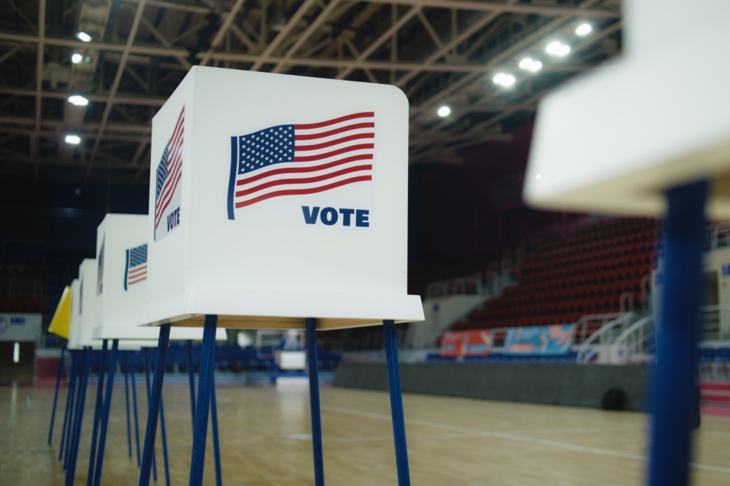 A voting booth with an American flag.