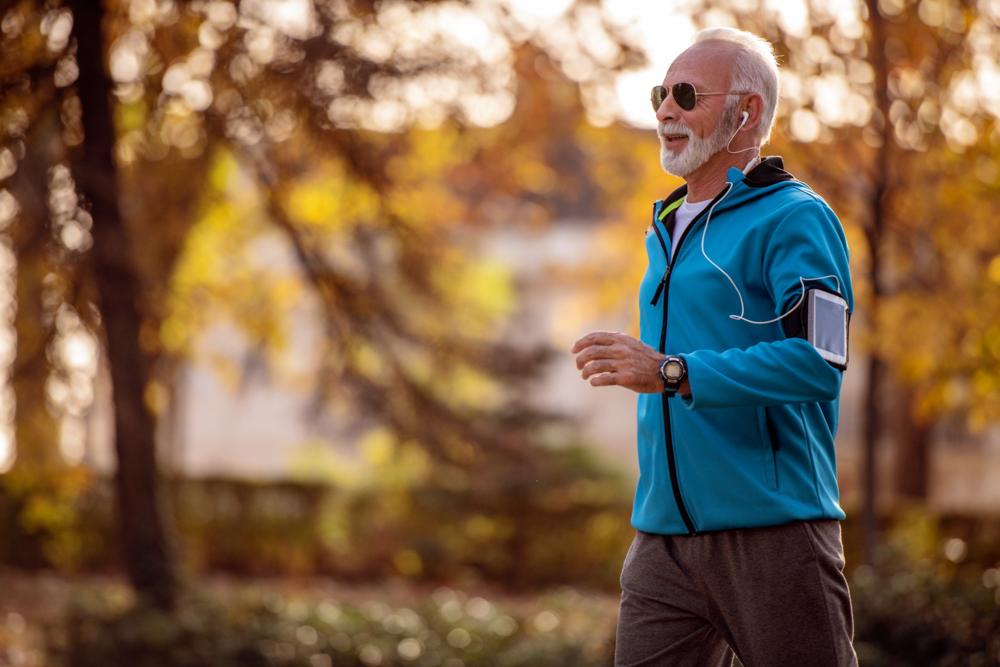A man jogging in a park.