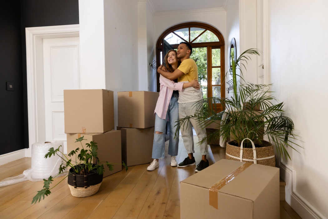 A couple moving into their new home.